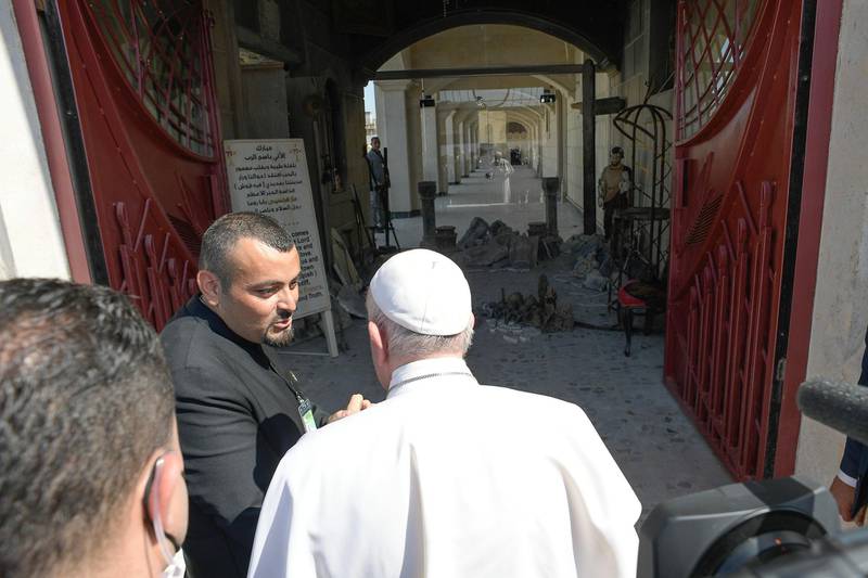 Pope Francis visits the town before holding a mass at the Grand Immaculate Church, in Qaraqosh. Reuters