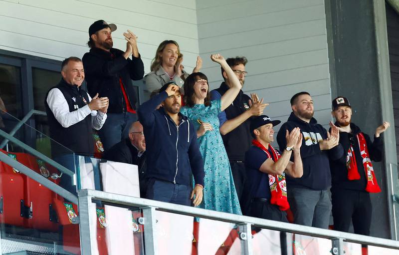 Reynolds at a football match with friends. Reuters