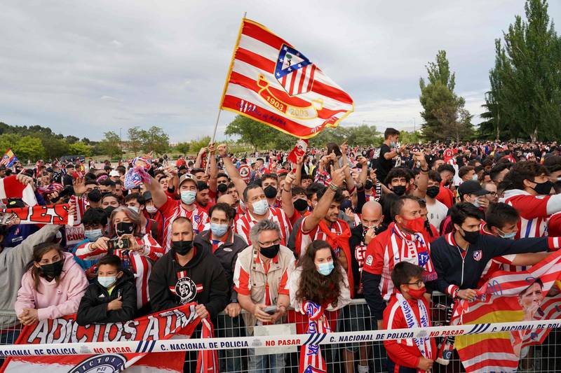 Supporters celebrate outside the Jose Zorilla stadium in Valladolid after Atletico Madrid were crowned La Liga champions for the first time since 2014. AFP