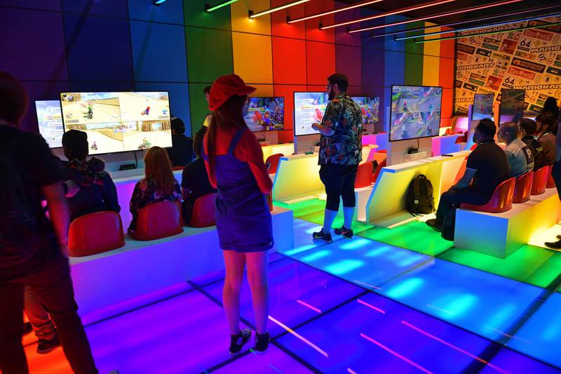 Gamers play video games during the Game XP event at the Olympic Park in Rio de Janeiro, Brazil on September 7, 2018. - The four day event aims to be the largest video gaming event in Latin America and attracts computer gamers and comic book enthusiasts. (Photo by CARL DE SOUZA / AFP)