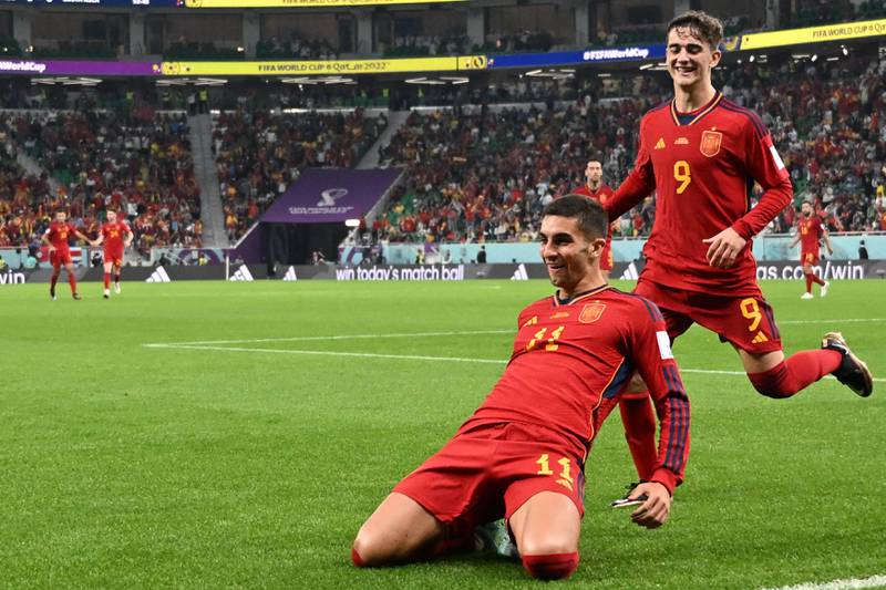 Spain's Ferran Torres celebrates with teammates after scoring his team's fourth goal. AFP