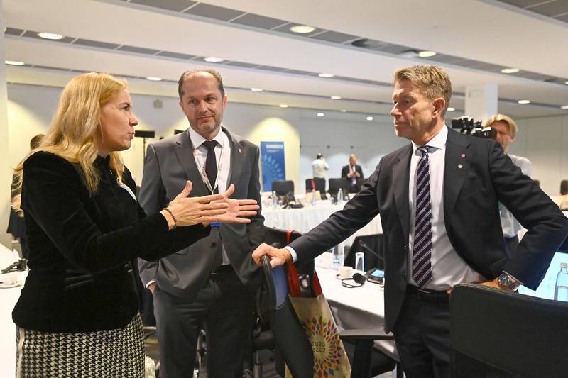 European Commissioner for Energy Kadri Simson, left, talks with the director of the Swiss Federal Office of Energy Benoit Revaz, centre, and Norwegian Petroleum and Energy Minister Terje Aasland before the start of an informal meeting of European energy ministers in Prague, Czech Republic. AFP