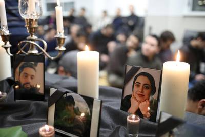 Photographs of student victims of a Ukrainian passenger jet which crashed in Iran are seen during a vigil at University of Toronto.  Reuters