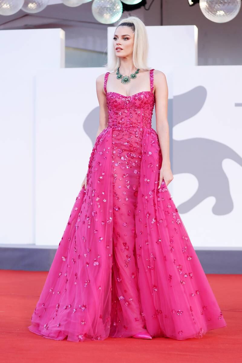 At the 78th Venice International Film Festival in 2021, Sara Croce wore a hot pink embellished gown by Zuhair Murad. Getty Images