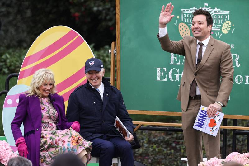 U. S.  President Joe Biden and first lady Jill Biden react as television host Jimmy Fallon waves during a reading of books session at the annual Easter Egg Roll on the South Lawn of the White House in Washington, U. S. , April 18, 2022.  REUTERS / Evelyn Hockstein