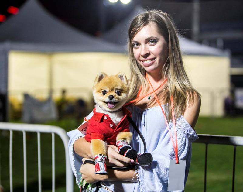 ABU DHABI, UNITED ARAB EMIRATES, 28 OCTOBER 2018 -A proud pet owner at the inaugural of Yas Pet Together event at Yas Du Arena, Abu Dhabi.  Leslie Pableo for The National for Evelyn Lau's story