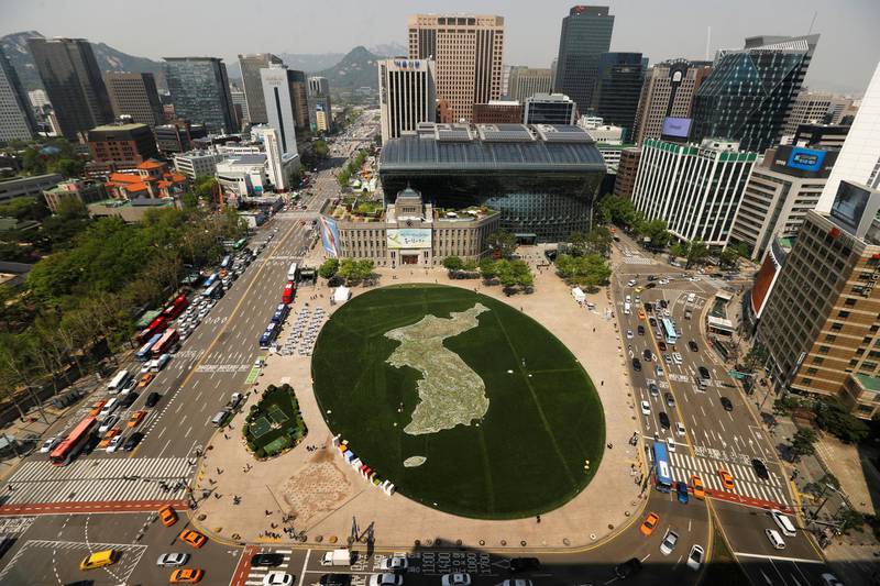 The shape of the Korean peninsula is seen on the lawn in front of City Hall ahead of the upcoming summit between North and South Korea in Seoul. Jorge Silva / Reuters