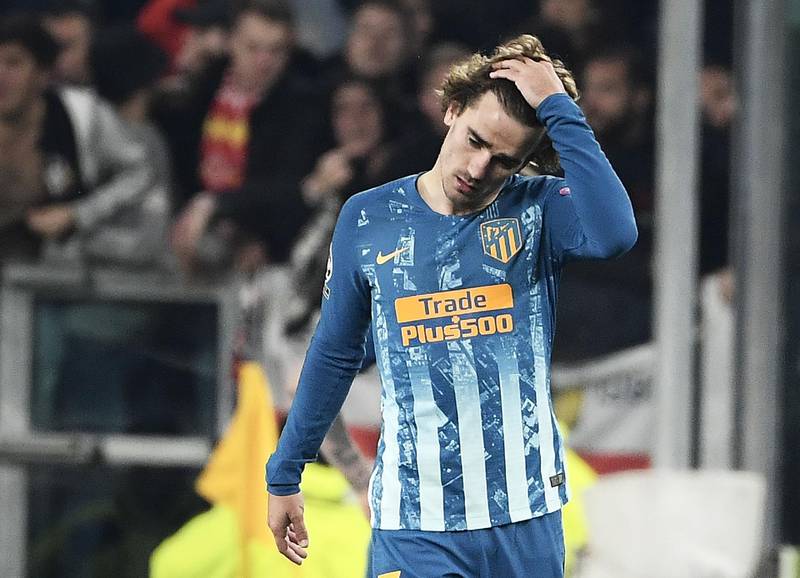 Atletico Madrid's French forward Antoine Griezmann leaves the pitch dejected as his side crash out of the Champions League. AFP