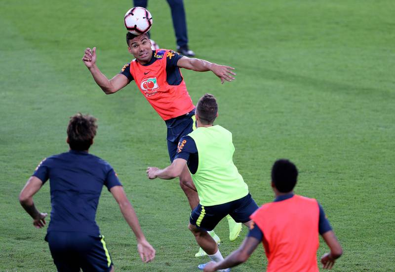 Brazil's Carlos Casimiro heads the ball during training in Abu Dhabi. AP