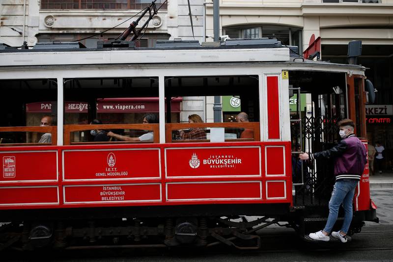 People use the tram on Istiklal street, the main shopping street in Istanbul, Turkey. AP Photo