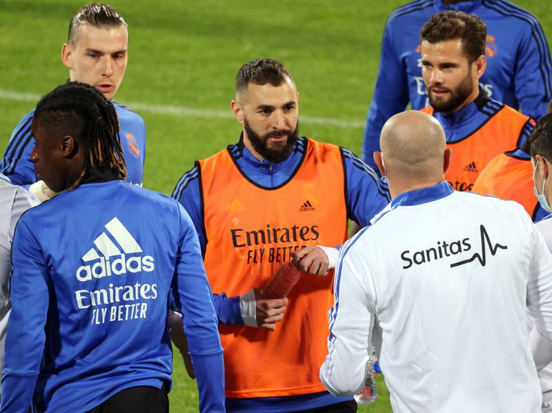 Karim Benzema listens to instructions during a training session.