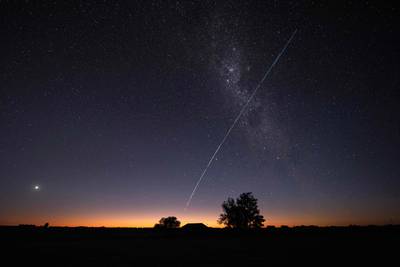 A trail of a group of SpaceX's Starlink satellites passing over Uruguay, with part of the Milky Way and Venus also in the frame. AFP