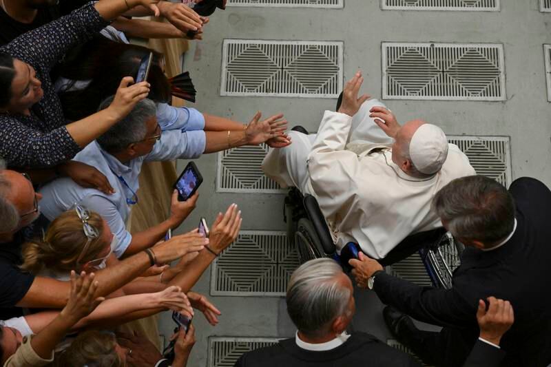 The crowd greets Pope Francis during the weekly general Papal audience in Paolo VI Hall at the Vatican. EPA