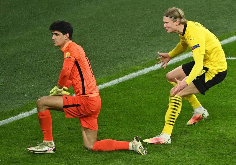 Soccer Football - Champions League - Round of 16 Second Leg - Borussia Dortmund v Sevilla - Signal Iduna Park, Dortmund, Germany - March 9, 2021 Borussia Dortmund's Erling Braut Haaland celebrates scoring their second goal as Sevilla's Bono looks on Pool via REUTERS/Ina Fassbender