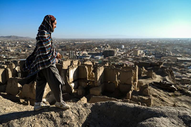 A member of Taliban security stands guard on top of an ancient fortress in Ghazni province. AFP