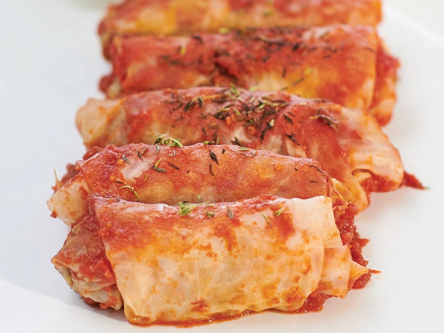 A recipe for walnut cabbage rolls is part of the cookbook.