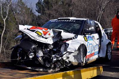 The wrecked car of Formula One driver Robert Kubica, of Poland, is towed in Andora, Italy, Sunday, Feb. 6, 2011.  Kubica was injured Sunday in a rally car accident in Italy just weeks before the start of the new Grand Prix season, his Lotus Renault team and health authorities said. Health officials in Italy said Kubica's life was not in danger, and that the worst damage appeared to be to his limbs. The 26-year-old driver was still undergoing exams. (AP Photo/Roberto Ruscello) *** Local Caption ***  AND106_Italy_F1_Renault_Kubica_Injured.jpg