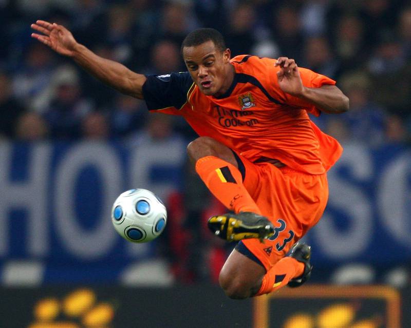 GELSENKIRCHEN, GERMANY - NOVEMBER 27: Vincent Kompany of Manchester City shoots the ball during the UEFA Cup Group A match between FC Schalke 04 and Manchester City at the Veltins Arena on November 27, 2008 in Gelsenkirchen, Germany.  (Photo by Christof Koepsel/Bongarts/Getty Images)