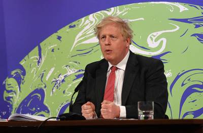 FILE - In this April 22, 2021 file photo, British Prime Minister Boris Johnson speaks during the opening session of the virtual global Leaders Summit on Climate, as he sits in the Downing Street Briefing Room in central London. Johnson is happy with U.S. President Joe Bidenâ€™s commitment to fighting climate change and Bidenâ€™s promise to start sharing coronavirus vaccines with poorer countries. But Johnson will struggle to make progress on a U.S.-U.K. trade deal, which is not a Biden priority. (Justin Tallis/Pool Photo via AP, File)