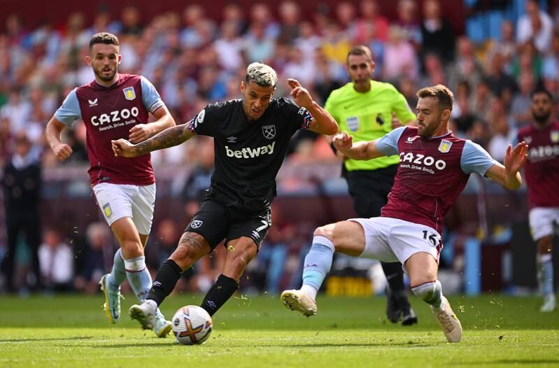 Gianluca Scamacca of West Ham United shoots whilst under pressure from Calum Chambers of Aston Villa. Getty Images