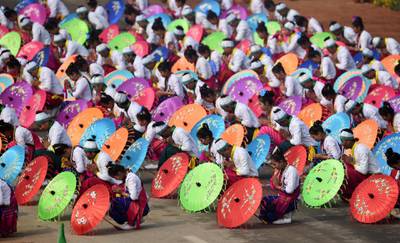School students perform during the parade in New Delhi. Money Sharma / AFP