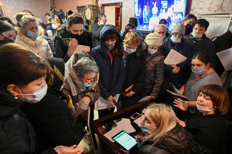 After the evacuation of separatist-controlled regions of eastern Ukraine, people complete documents in a temporary accommodation centre in Rostov, Russia. Reuters