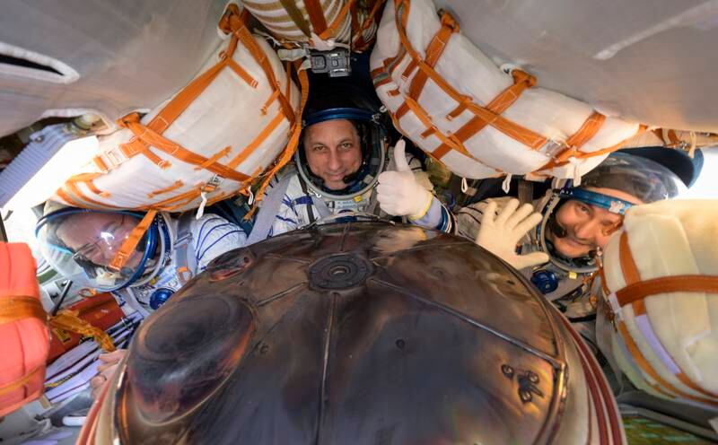 Nasa astronaut Mark Vande Hei of Nasa, left, returns from the ISS with cosmonauts Anton Shkaplerov, centre, and Pyotr Dubrov. EPA