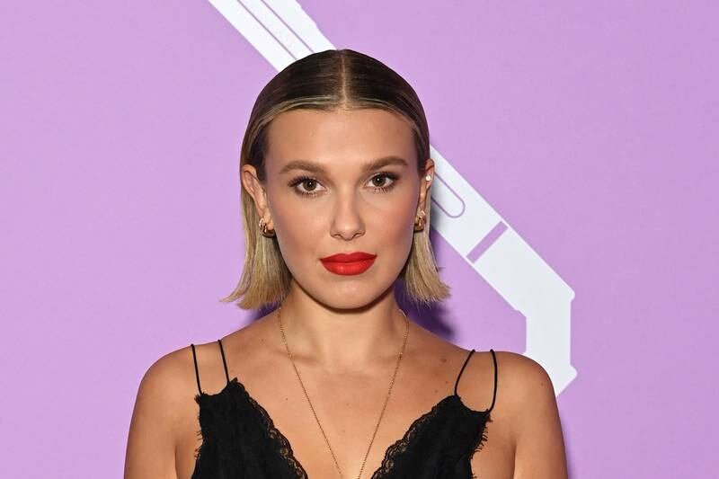 'Enola Holmes' star Millie Bobby Brown slicks her bob back from its middle parted style.  AFP