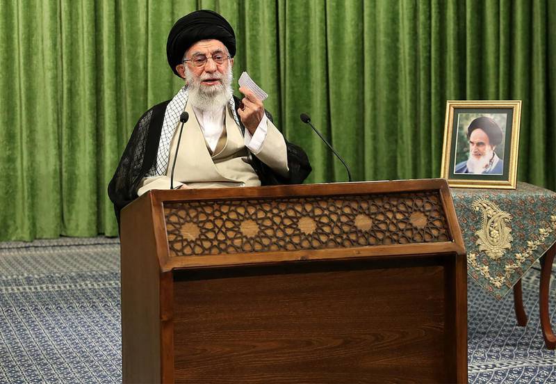 This handout picture provided by the office of Iran's Supreme Leader Ayatollah Ali Khamenei on May 27, 2021 shows him addressing parliament members during an online meeting in the Iranian capital Tehran, with a picture of his predecessor, the late Ayatollah Ruhollah Khomieni next to him. Khamenei urged Iranians to ignore calls to boycott next month's presidential election, after several hopefuls were barred from running against ultraconservative candidates. Iran is set to elect a successor to President Hassan Rouhani on June 18 amid widespread discontent over a deep economic and social crisis. - === RESTRICTED TO EDITORIAL USE - MANDATORY CREDIT "AFP PHOTO / HO / KHAMENEI.IR" - NO MARKETING NO ADVERTISING CAMPAIGNS - DISTRIBUTED AS A SERVICE TO CLIENTS ===
 / AFP / KHAMENEI.IR / - / === RESTRICTED TO EDITORIAL USE - MANDATORY CREDIT "AFP PHOTO / HO / KHAMENEI.IR" - NO MARKETING NO ADVERTISING CAMPAIGNS - DISTRIBUTED AS A SERVICE TO CLIENTS ===
