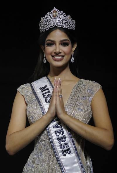 The new Miss Universe Harnaaz Sandhu of India gestures to the audience after being crowned at the Miss Universe 2021 pageant. EPA