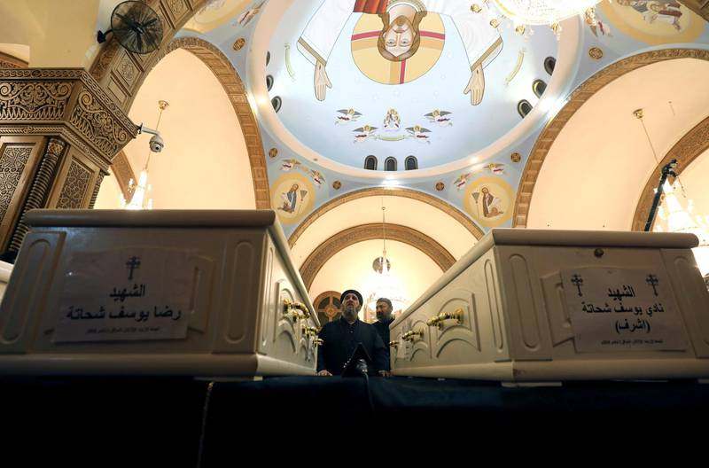 A cleric prays during the Church Mass ahead of the funeral of Coptic Christians who were killed in an attack at the Prince Tadros Church in Minya, Egypt. Reuters