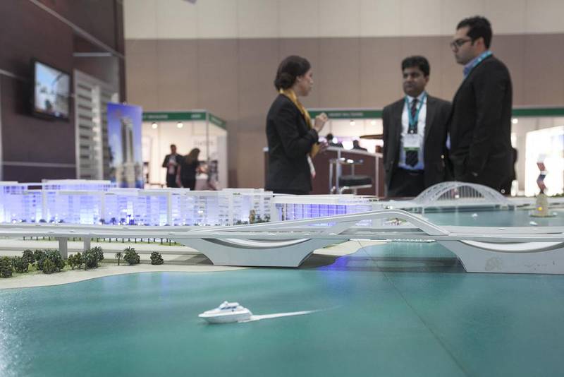 Cityscape Abu Dhabi 2015 participants view a scaled version of a property project. Mona Al Marzooqi / The National