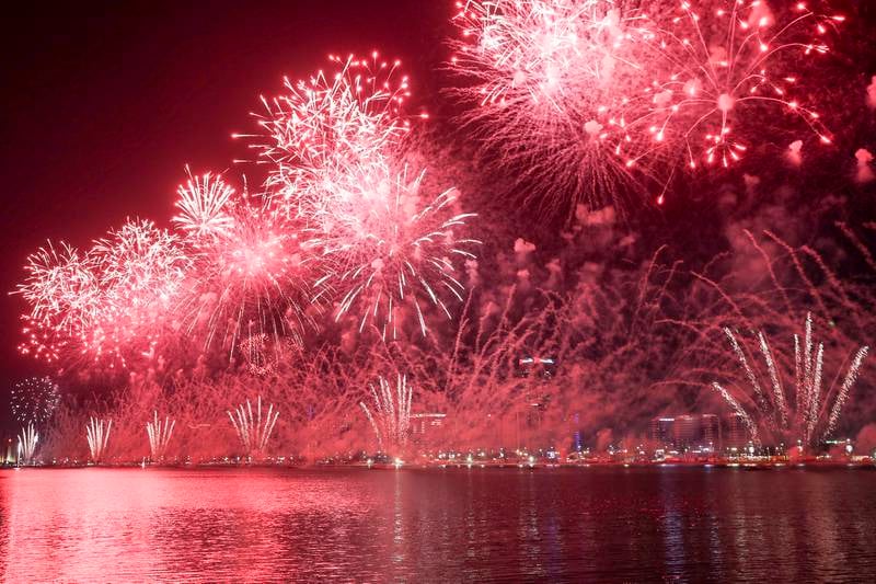 Grand fireworks light up the night sky along the Corniche for UAE at 50 celebrations, Abu Dhabi. Khushnum Bhandari / The National
