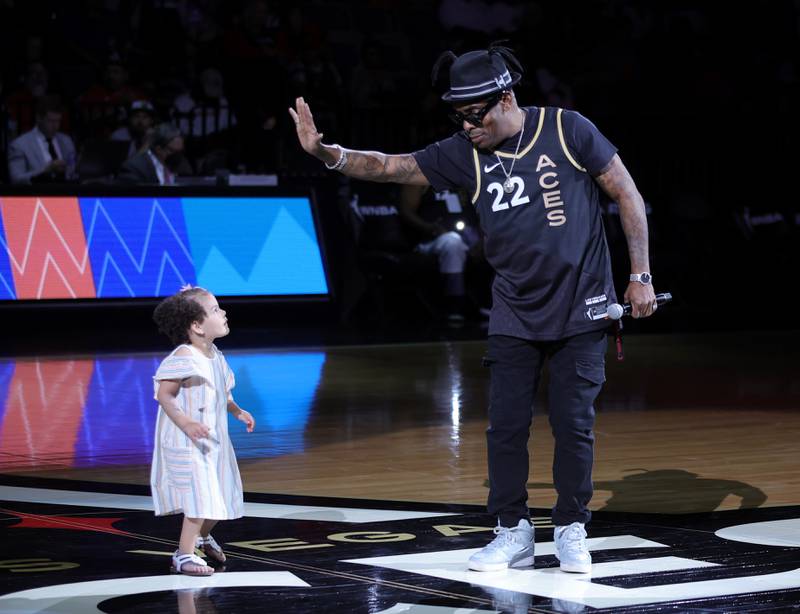 Coolio and his granddaughter Arya Ivey perform at a basketball game in Las Vegas in May. AFP
