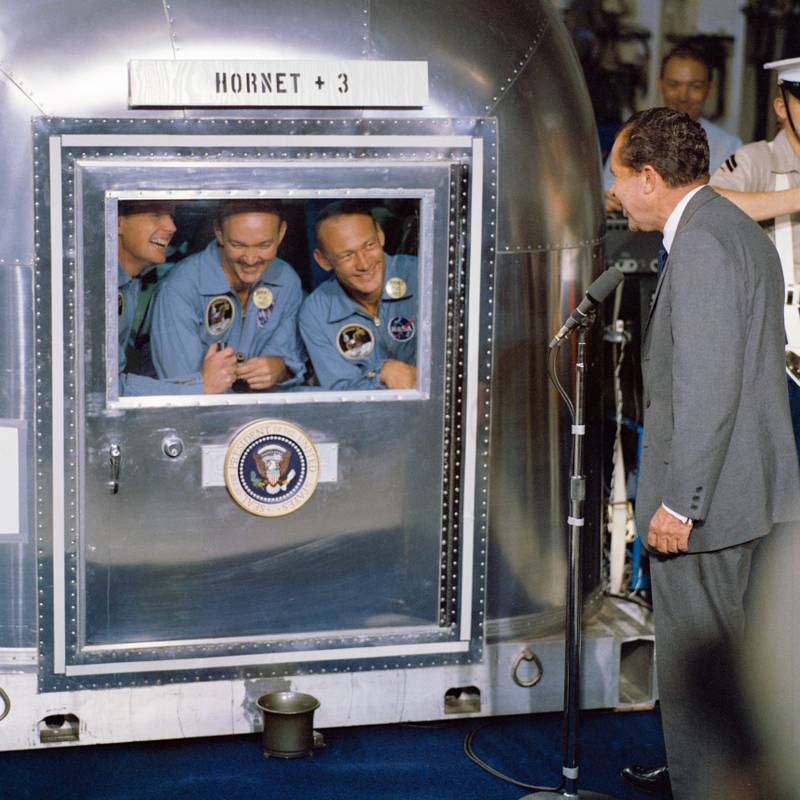 President Richard Nixon speaks to the Apollo 11 astronauts while they quarantined in 1969. (L-R) Neil  Armstrong, Michael Collins and Buzz Aldrin. Photo: Nasa