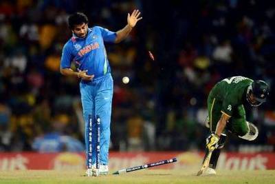 Pakistan's Yasir Arafat is run out as India's Zaheer Khan watches the bails come off. There was plenty of drama in Colombo tonight. Philip Brown / Reuters