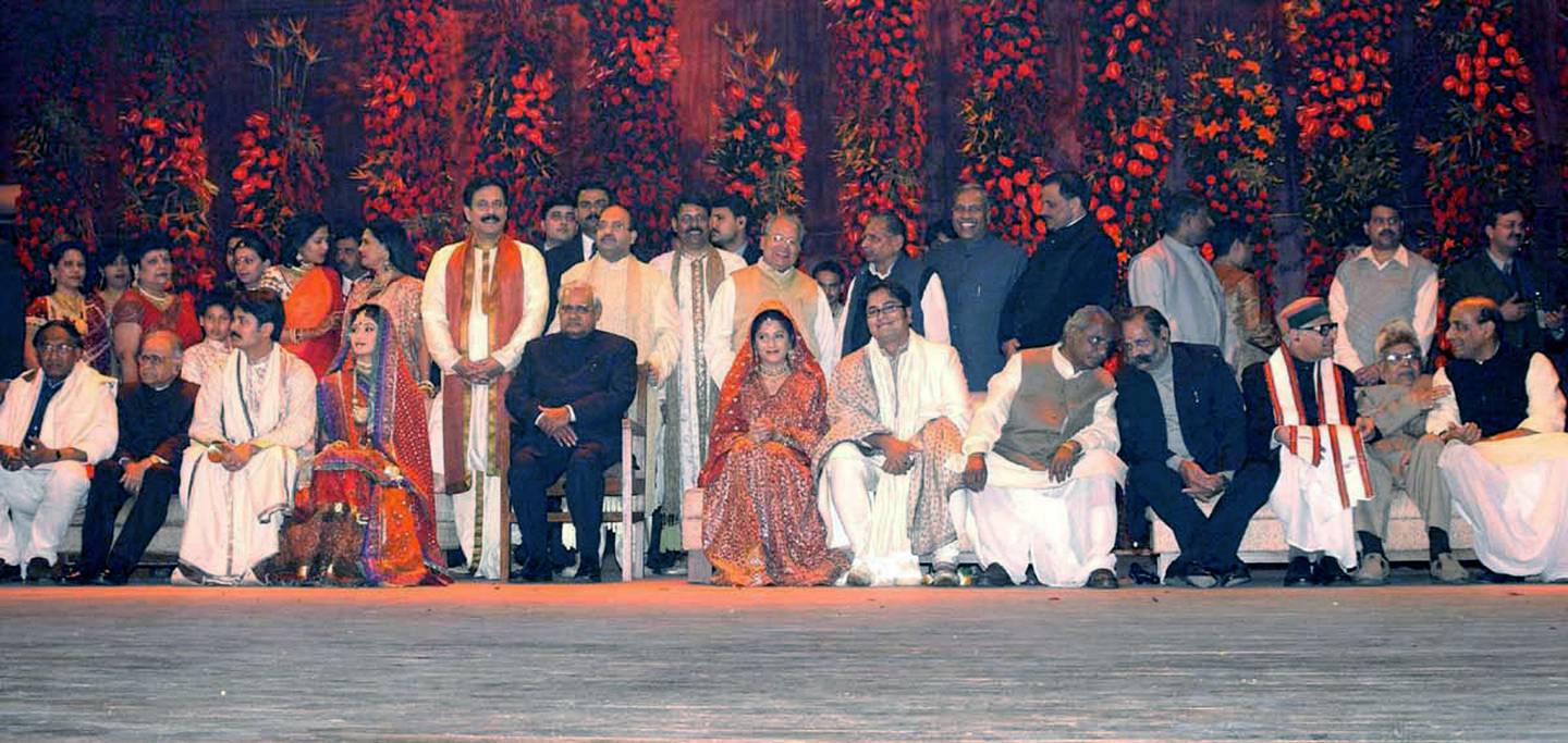 Sahara India group chief Sboroto Roy stands behind then Indian Prime Minister Atal Behari Vajpayee at the wedding of Roy's eldest son, Sushanto, in Lucknow in February, 2004.  AFP