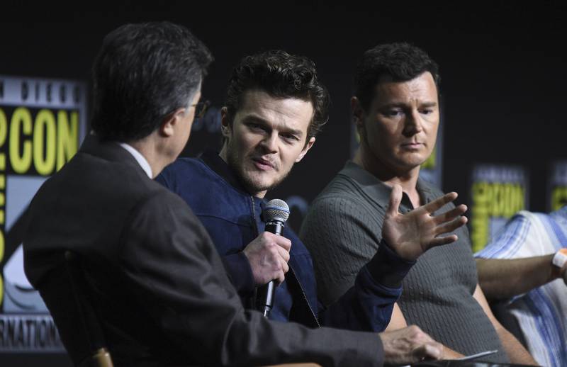 From left, moderator Stephen Colbert, Robert Aramayo and Benjamin Walker participate in a panel for 'The Lord of the Rings: The Rings of Power' on day two of Comic-Con International. AP