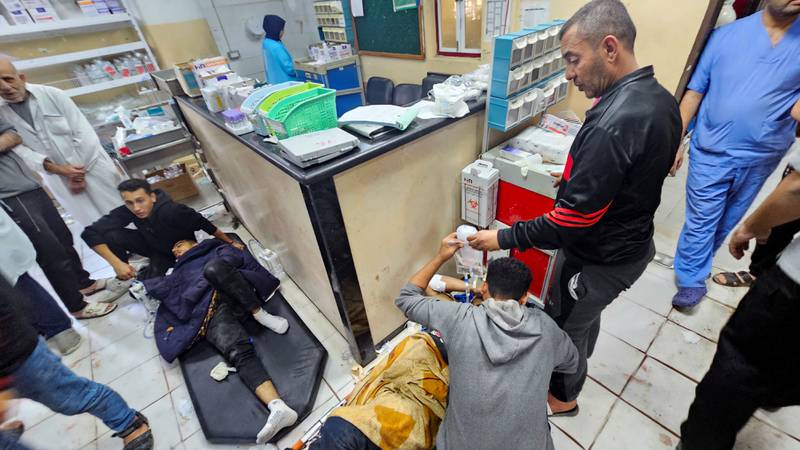 Palestinians wounded in Israeli strikes lie on the floor as they are assisted at the Indonesian Hospital in Gaza. Reuters
