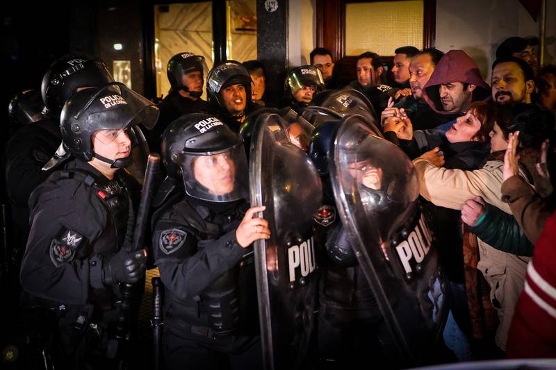 Police arrive to control protesters outside the home of Argentinian Vice President Cristina Fernandez in Buenos Aires, in August. EPA