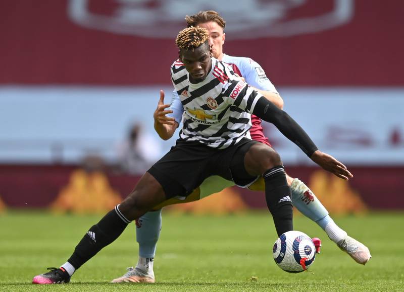 United midfielder Paul Pogba is challenged by Villa's Matty Cash. EPA