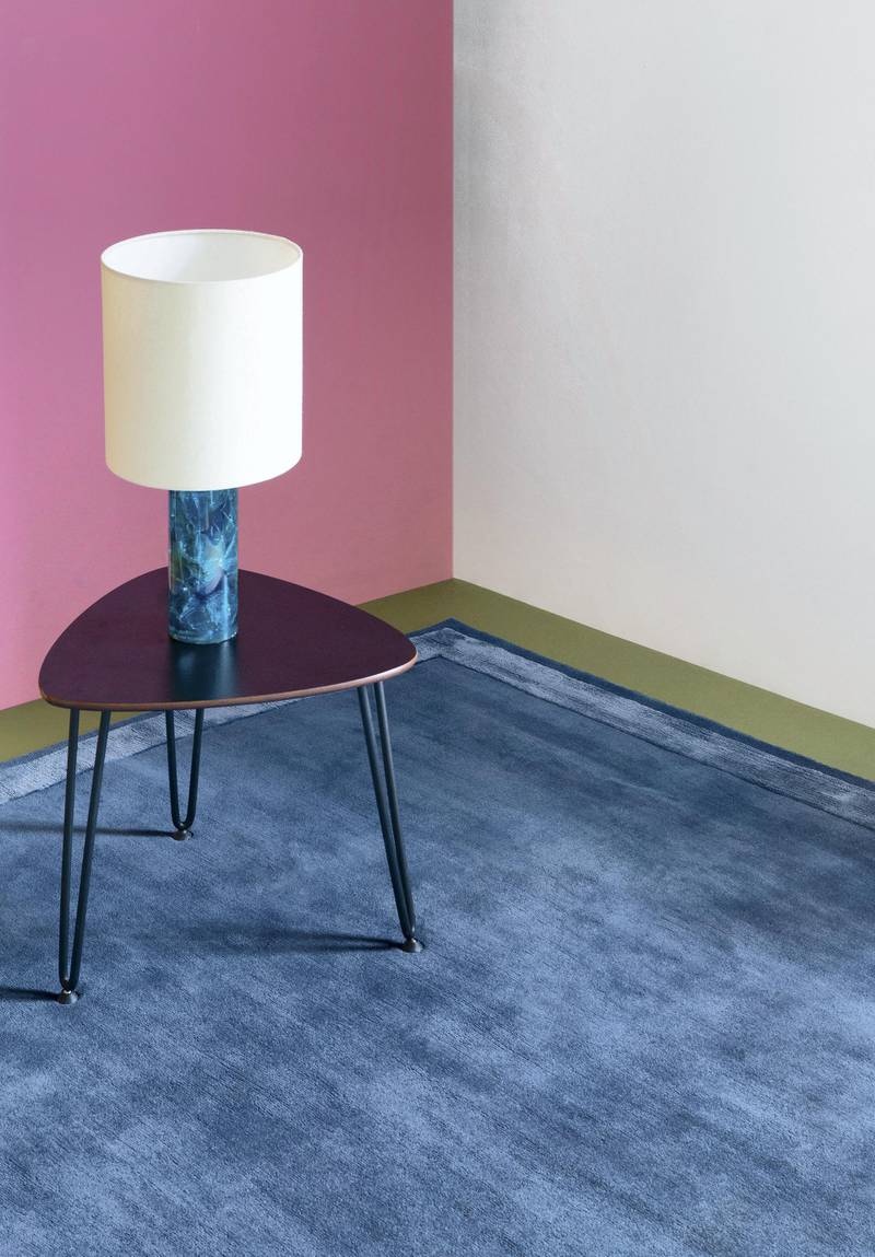 A classic blue carpet can make a room feel more cosy. Photo: The Rug Company