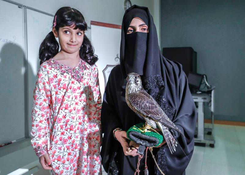 Abu Dhabi, United Arab Emirates, October 24, 2019.  Falconry class at NYUAD.--  Ayesha Al Mansooriand daughter, Osha Khaleefa Al Mansoori with Yas,  the 8 month old falcon.Victor Besa/The NationalSection:  NAReporter:  Rupert Hawksley