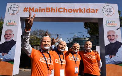 NEW DELHI, INDIA - MARCH 31: BJP workers wearing mask of Prime Minister Narendra Modi, at the main gate of Talkatora Stadium where Modi interacted with people under 'Main bhi Chowkidar' campaign, on March 31, 2019 in New Delhi, India. Two weeks after he launched Main Bhi Chowkidar (I too am watchman) campaign, Prime Minister Narendra Modi on Sunday afternoon, will interact with people who have pledged their support to the campaign, from 500 places across the country. (Photo by Arvind Yadav/Hindustan Times via Getty Images)