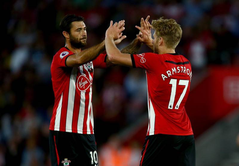 SOUTHAMPTON, ENGLAND - AUGUST 01:  Stuart Armstrong of Southampton celebrates with Charlie Austin of Southampton after he scores his sides second goal during the Pre-Season Friendly match between Southampton and Celta Vigo at St Mary's Stadium on August 1, 2018 in Southampton, England.  (Photo by Jordan Mansfield/Getty Images)