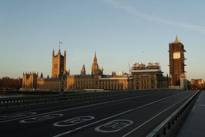 An almost empty Westminster Bridge stands backdropped by the early morning sun on March 24, 2020, the first day of Britain's first lockdown.  AP Photo