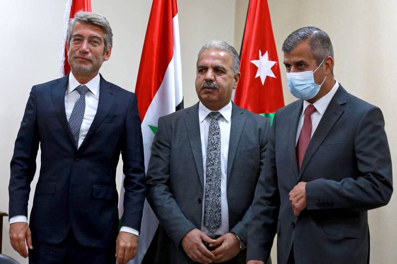 Jordan's Minister of Energy Saleh Al Kharbasha receives his counterparts from Syria Bassam Tohme and from Lebanon Walid Fayad during a meeting in Amman. AFP