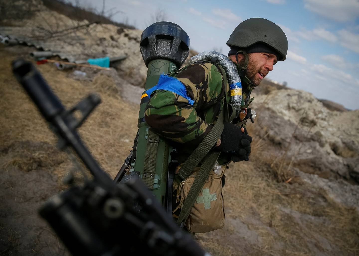 A Ukrainian troop holds an NLAW at a position on the front line in the northern Kyiv region. Reuters