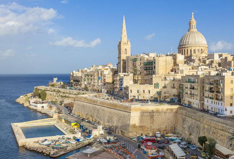The Valletta skyline with the dome of the Carmelite Church and St. Pauls Anglican Cathedral. Neale Clark / Robert Harding World Imagery / Corbis