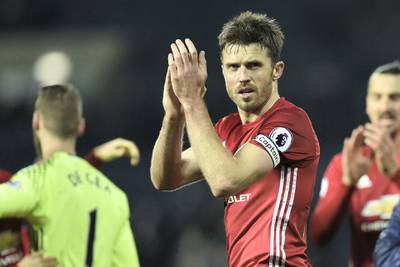 Manchester United's English midfielder Michael Carrick celebrates on the pitch after the English Premier League football match between West Bromwich Albion and Manchester United at The Hawthorns stadium in West Bromwich, central England, on December 17, 2016.

Manchester United won the game 2-0. / AFP PHOTO / Oli SCARFF / RESTRICTED TO EDITORIAL USE. No use with unauthorized audio, video, data, fixture lists, club/league logos or 'live' services. Online in-match use limited to 75 images, no video emulation. No use in betting, games or single club/league/player publications.  / 
